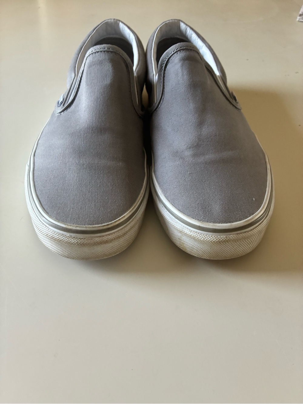 Vans Slip-On Sneakers in Light Gray and White